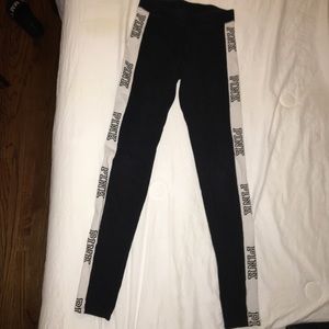 Black leggings with white stripes.